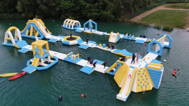 Aerial view of Fenland Aquapark and somebody jumping in from the high jump